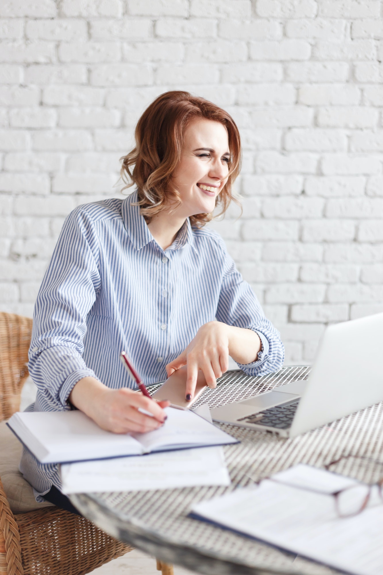Modern happy business woman in the office